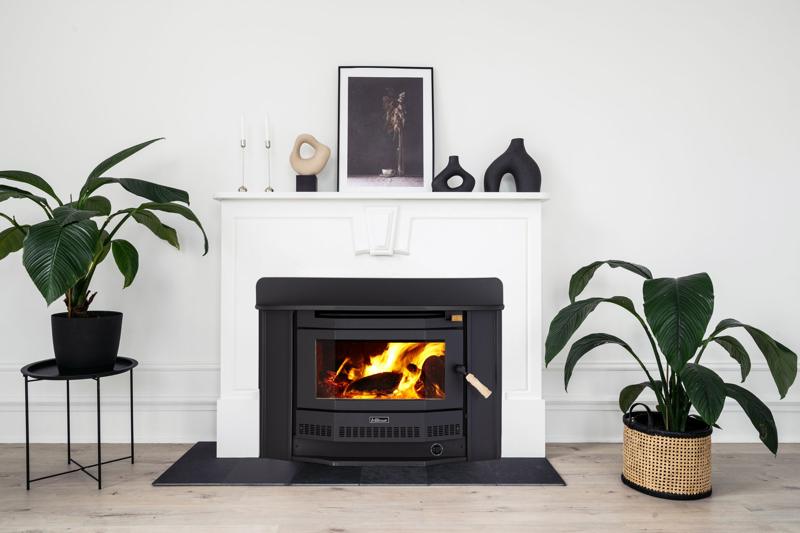 Ultimate inbuilt wood heater in a white mantel